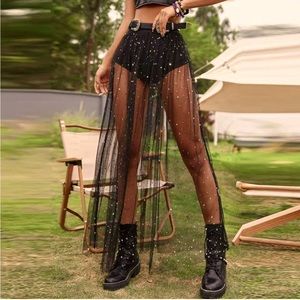 High-waisted black sheer skirt with small silver and gold stars. Never worn 🖤✨